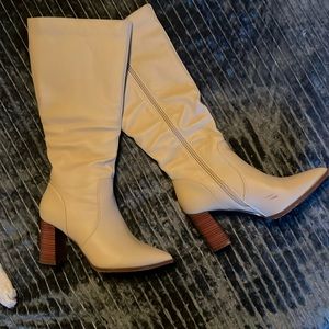 Selling cream colored , leather knee high 2 inch heel boots